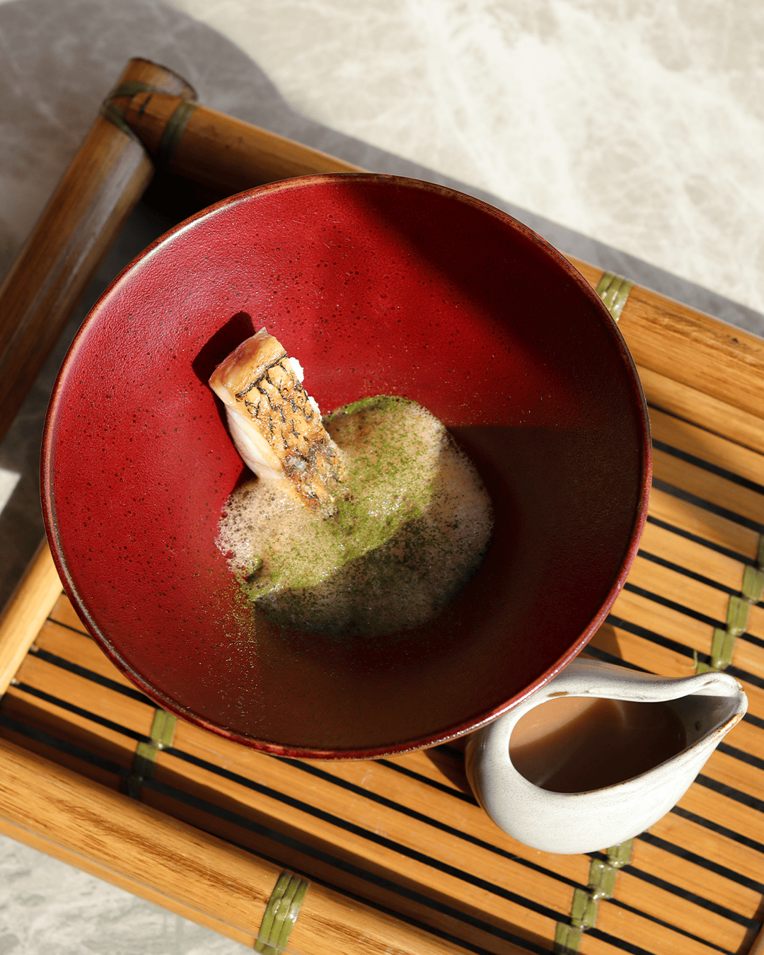 Fish in red lacquer bowl